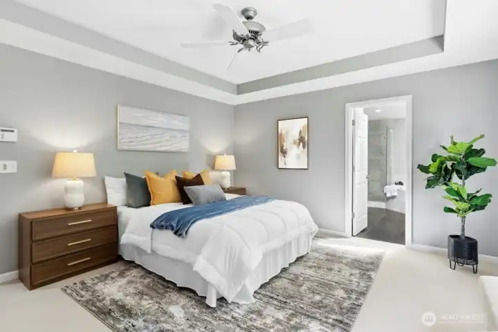Exquisite primary suite with coved ceilings And a picture perfect view of the private backyard through the large picture windows