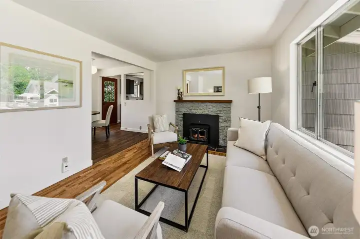 Recently refinished hardwood flooring and cozy fireplace insert for those chilly nights.