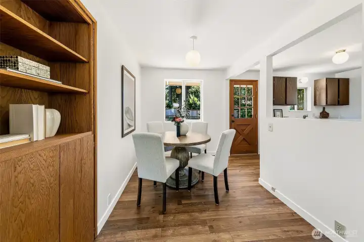 Sweet dining room and back door that leads to a deck.
