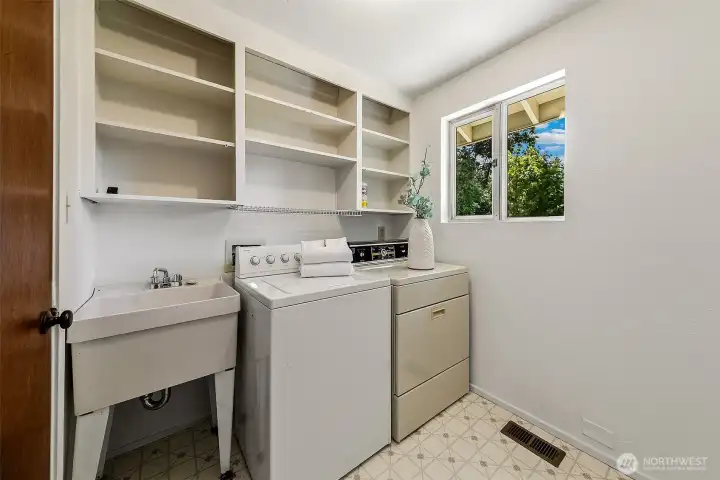 Wonderful utility room with plenty of storeage.