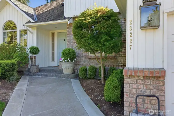 Brick adorned & spacious 3 car garage.