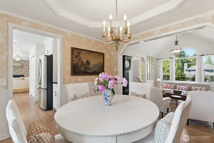 Colfax and Fowler wallpaper and an antique chandelier add warmth and sophistication.