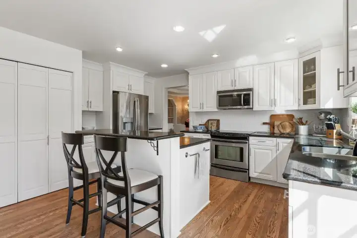 The island with breakfast bar seating and generous prep space.