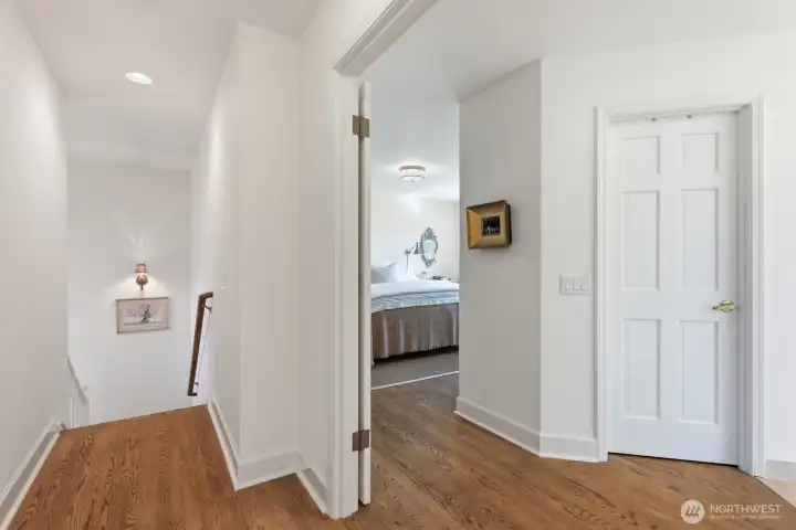 Hardwood floors grace the upper hallway.