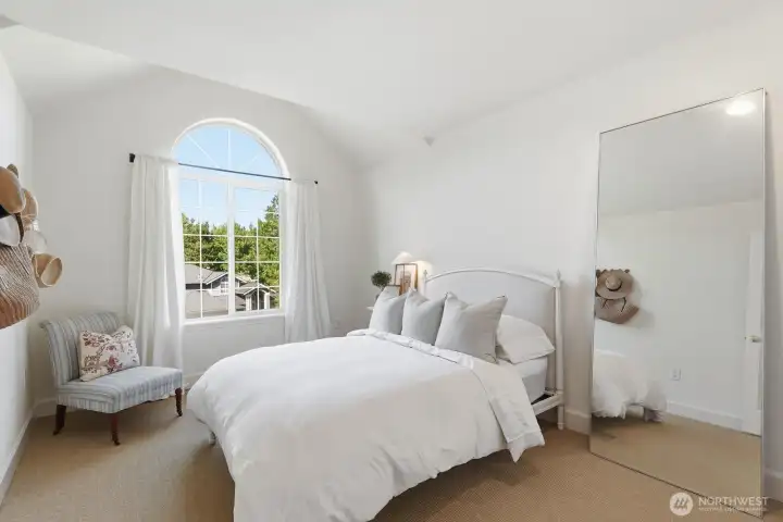 Bedroom 3 with vaulted ceiling and wall to wall sisal carpet.