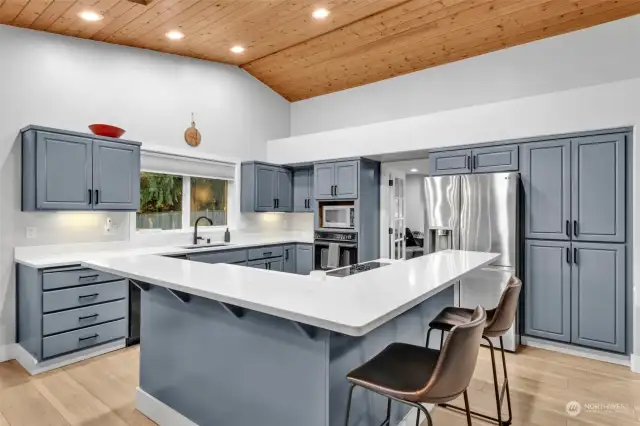 Ample sitting space at the kitchen counter.