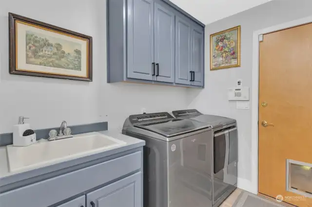 Utility room with sink off the 3 car garage.