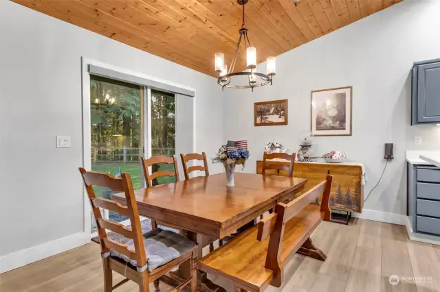 dinning area with slider to the fully fenced backyard.