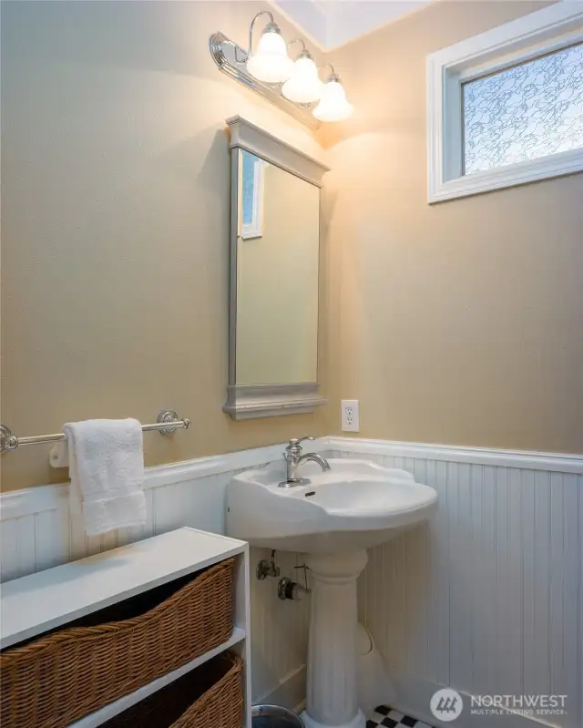 Half-bath on main floor off of the kitchen and entrance to garage