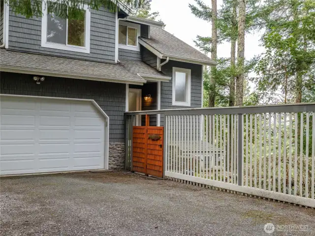 Attached two car garage and gated entry