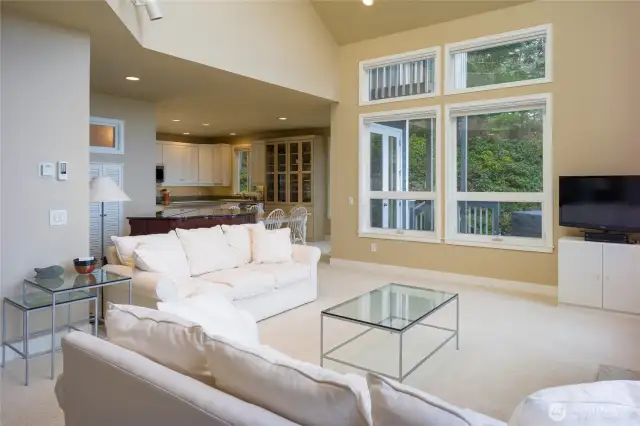 Kitchen off of the living room and sliding glass door out to hot tub and deck