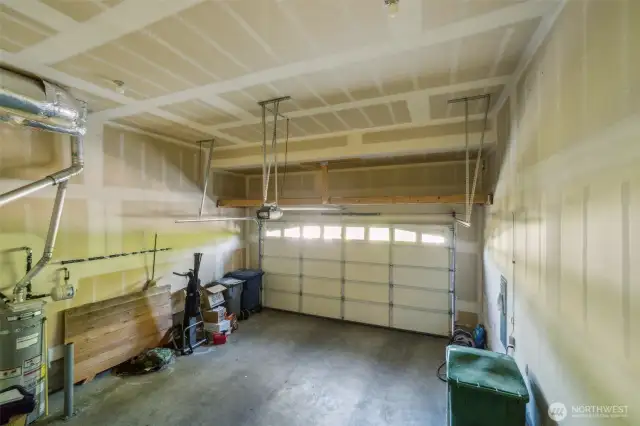 Large garage includes EV charger and extra storage.