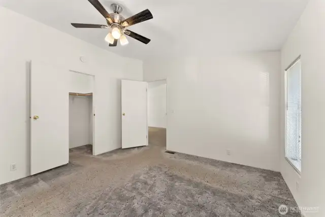 Primary suite with walk-in closet.
