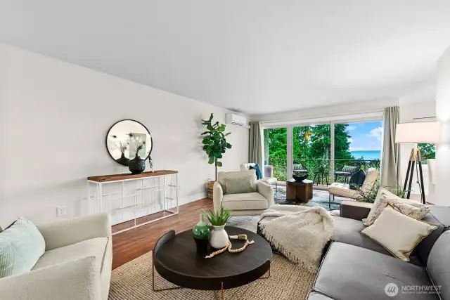 Ample room for furniture and huge Sliding Glass Door fills the Living Room with natural Light.  Mini-split AC unit in the top left to keep it comfortable in the Summer Months.