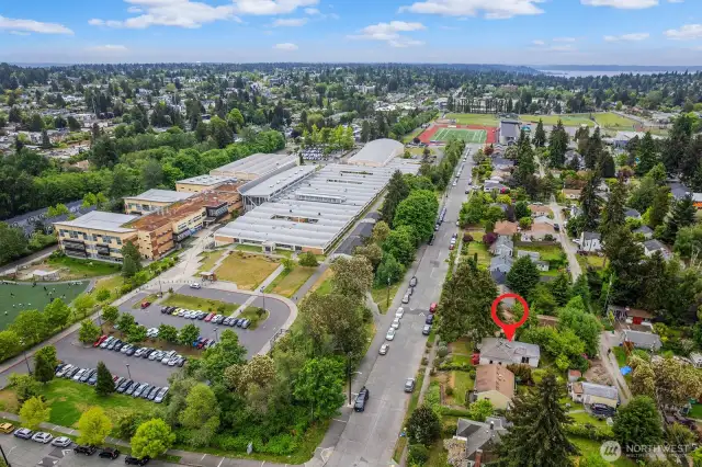 This drone shot shows Denny Middle School and Chief Sealth International High School campuses and playfields across the street from the property. The Southwest Pool facility on Thistle, with a heated indoor pool, is just around the corner, too.