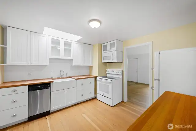 With the warmth of fir flooring and wood counter-tops, the 2018 updated kitchen is fresh and bright.