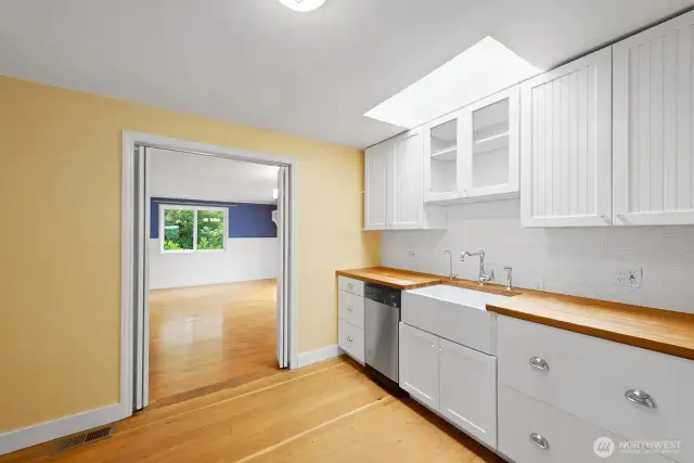 The skylight was replaced around 2016. There is a pocket door through which a fantastic bonus room is found!