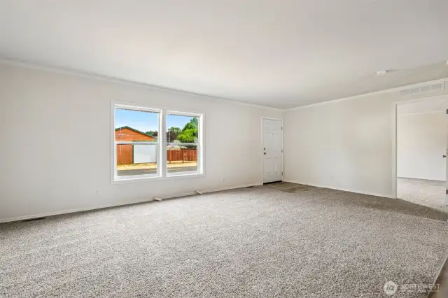 This is a very open split bedroom floorplan.  The primary bedroom is to the right of the front entrance from this direction.