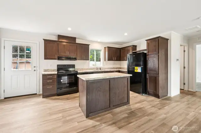 There is a back-door that exits out from the kitchen.