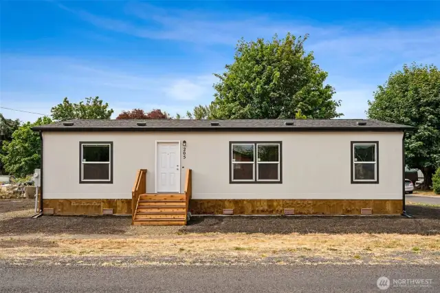 Clean lines, a crisp exterior, and thoughtful landscaping make this home a standout from the very first glance.