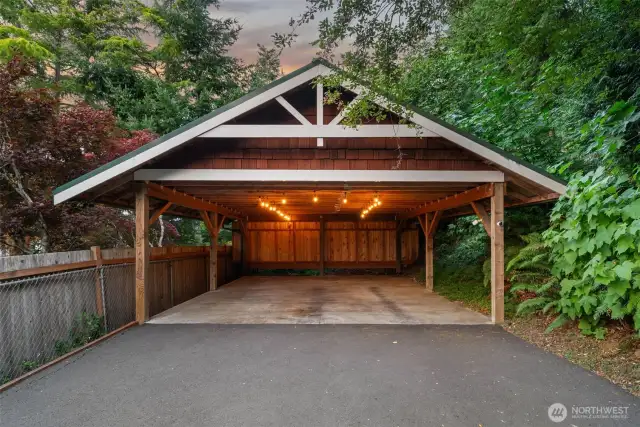 Carport holds 2 cars + additional uncovered parking.
