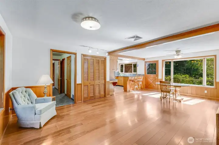 Open family room, dining and kitchen has pantry and LVP flooring for easy maintenance