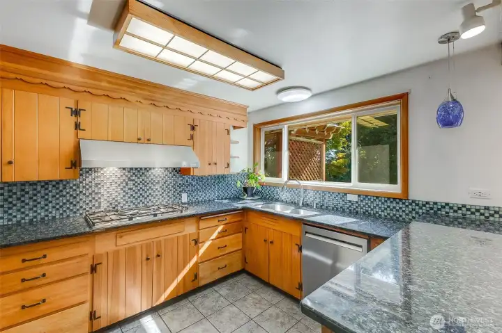 Kitchen also features tiled floors, SS Steel Appliances, Double Oven and 5 burner gas stove top.