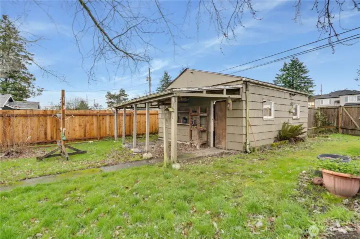 A large, detached garage adds value and versatility.