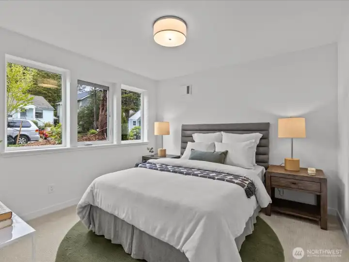 Main level bedroom with 3/4 bathroom just outside the door - Great for guests! Model home.