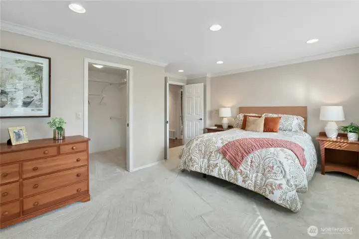 The bedroom opens to a large walk-in closet, with a small bonus closet at the back for suitcases or other storage.