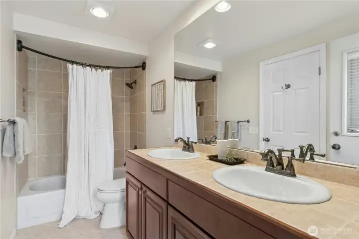 Also upstairs are two more bedrooms and another bathroom. Space for everyone!