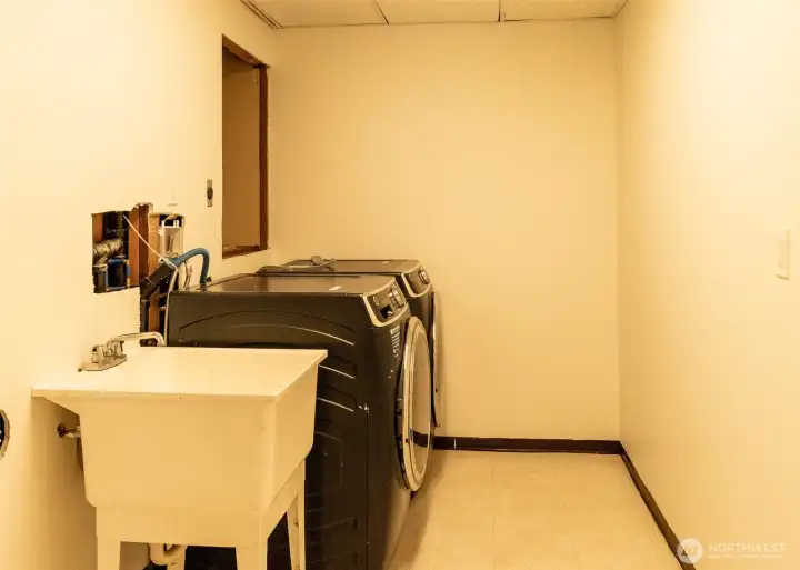 Laundry and utility sink are located on the lower level.