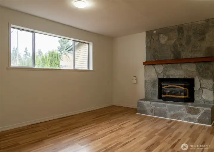 At the opposite end of the lower level is a 2nd bonus room with a fireplace insert. This room also has potential as a home office, 2nd suite, hobby space or ... imagination goes here!