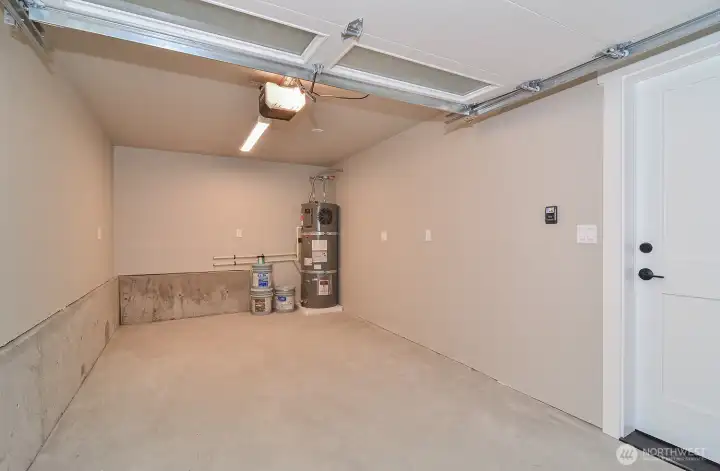 Finished single car garage with electric charger ready.