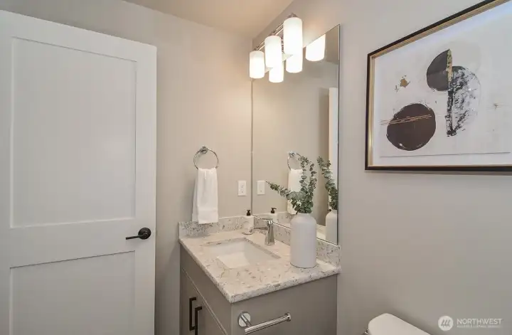 Upper level tiled full bath.