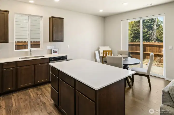 Serve all your guests from the nice sized quartz island.