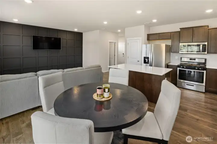 Dining, kitchen, great room and perfectly located guest bathroom.