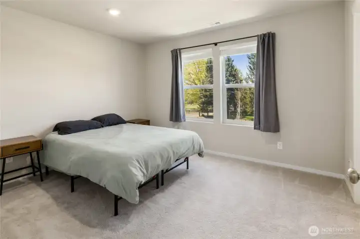 The primary bedroom is opposite of bedrooms two and three.