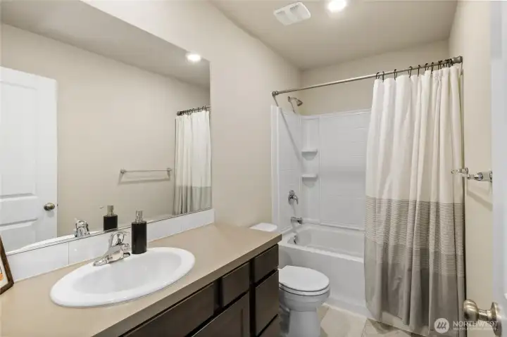 Full bathroom for bedrooms two and three.