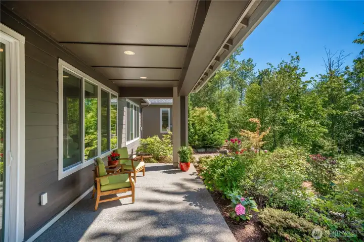 Generous covered patio overlooking the beautiful backyard and permanent greenspace. Generous covered patio overlooking the beautiful backyard and permanent greenspace.