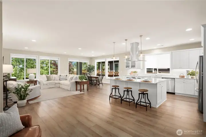 Luxury, wide plank waterproof flooring flow seamlessly through this stunning home creating a very sophisticated feel. The gorgeous & pristine kitchen and living spaces all overlook the scenic backyard. Luxury, wide plank waterproof flooring flow seamlessly through this stunning home creating a very sophisticated feel. The gorgeous & pristine kitchen and living spaces all overlook the scenic backyard.
