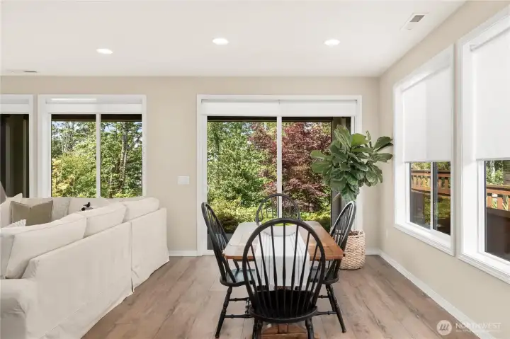 Spacious dining area overlooking your private greenspace. Custom roller shades throughout. Spacious dining area overlooking your private greenspace. Custom roller shades throughout.