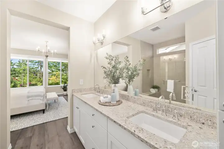 The primary bath with classy Quartz counters & fixtures, waterproof flooring and a fully tiled shower with a bench and a handy niche. The primary bath with classy Quartz counters & fixtures, waterproof flooring and a fully tiled shower with a bench and a handy niche.