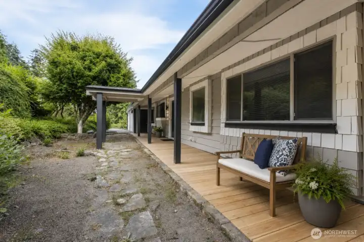 Covered front deck: some decor digitally staged. Covered front deck: some decor digitally staged.