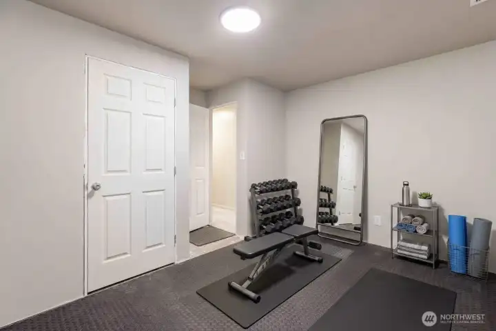 Extra finished room: digitally staged for home gym! Extra finished room: digitally staged for home gym!