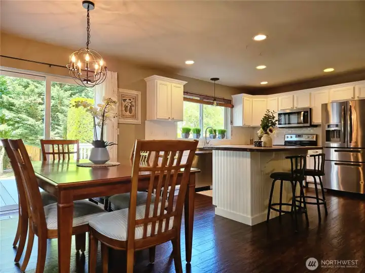 dining open to kitchen with beautiful view of back yard dining open to kitchen with beautiful view of back yard