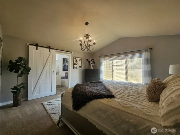 Main bedroom with vaulted ceilings and chandelier Main bedroom with vaulted ceilings and chandelier