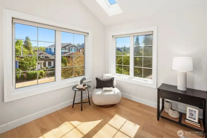 South facing primary bedroom with lots of lights.  There are a total of 5 skylights upstairs.