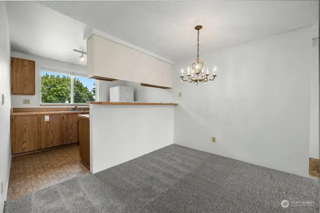 Another angle of your dining space with an elegant chandelier.