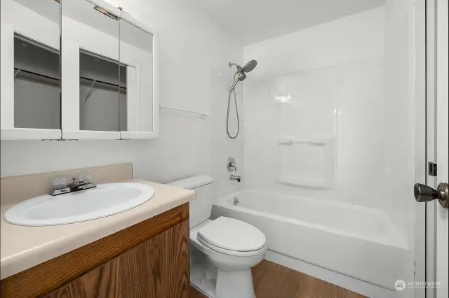 Spacious full bath between the bedrooms and main living space.